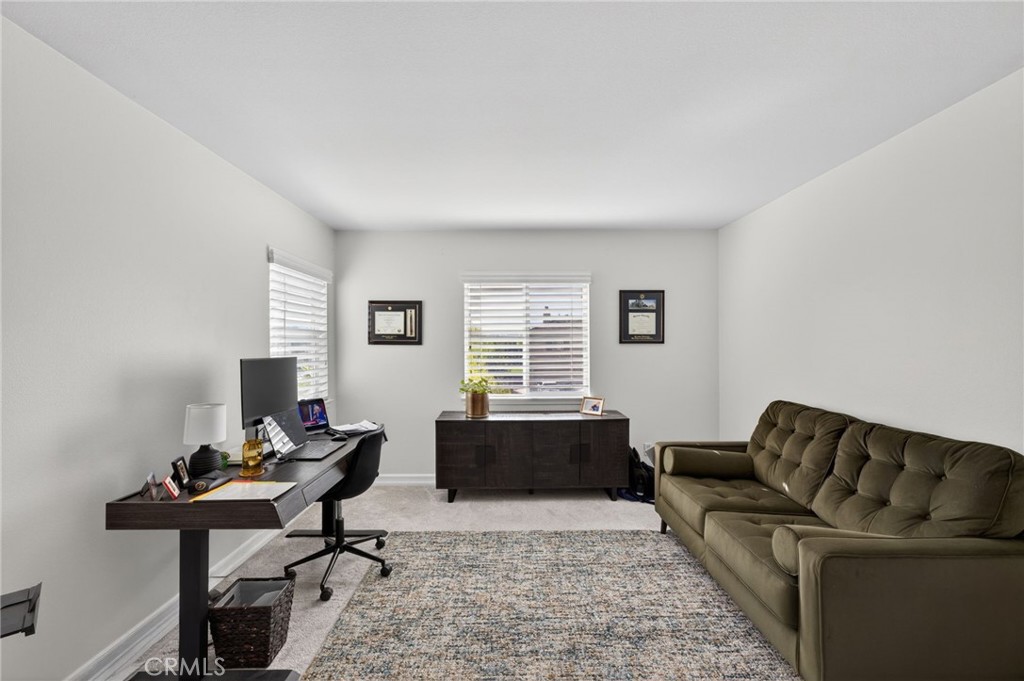45136 Willowick Street Temecula, CA 92592 - Photo 44 of 75 a living room with furniture and a flat screen tv