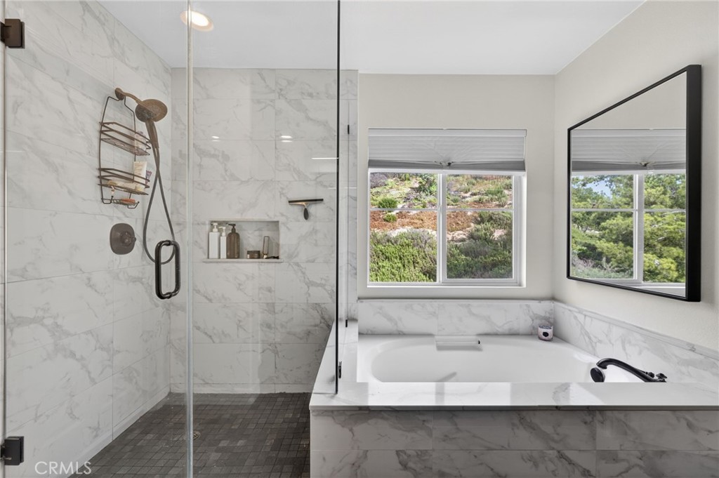 45136 Willowick Street Temecula, CA 92592 - Photo 48 of 75 a bathroom with a bath tub and shower