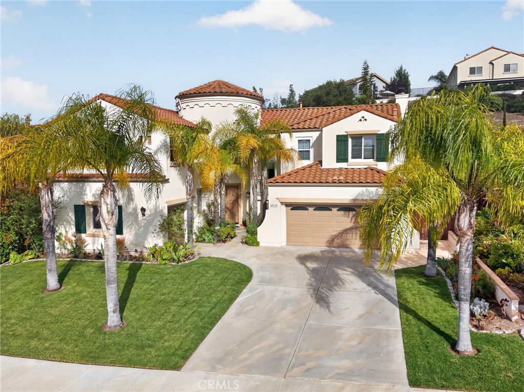 45136 Willowick Street Temecula, CA 92592 - Photo 60 of 75 a view of a white house with a big yard plants and large trees