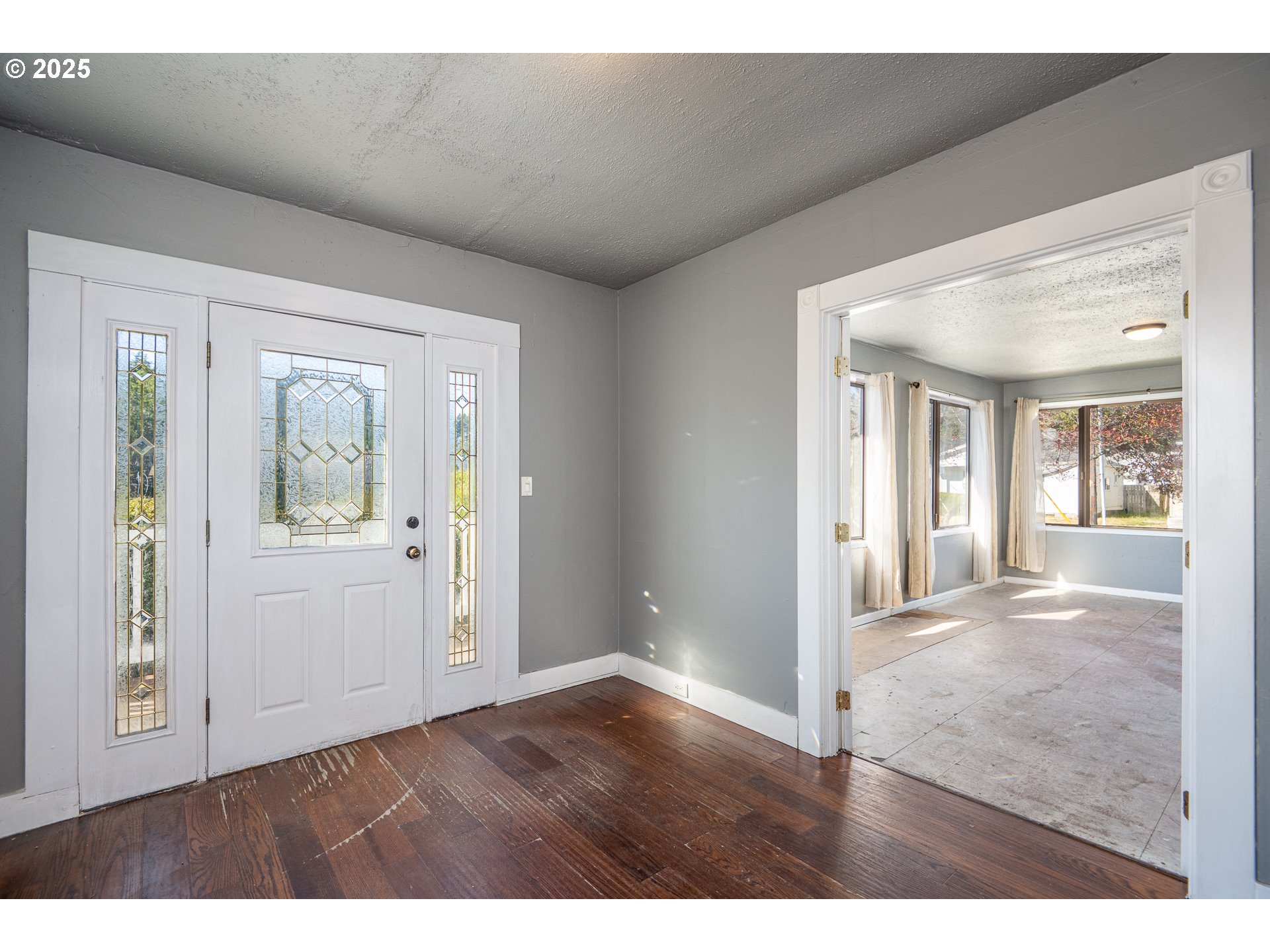289 Harbor Street Florence, OR 97439 - Photo 12 of 47 a view interior of a house wooden floor wooden floor and windows