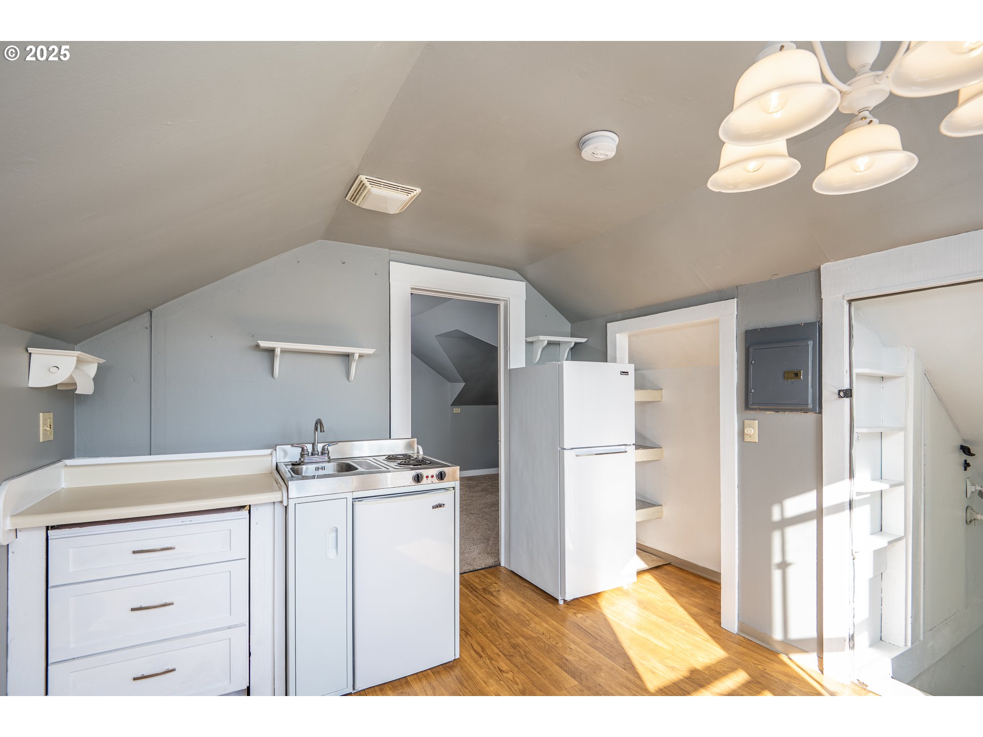 289 Harbor Street Florence, OR 97439 - Photo 30 of 47 a kitchen with a refrigerator a sink and cabinets
