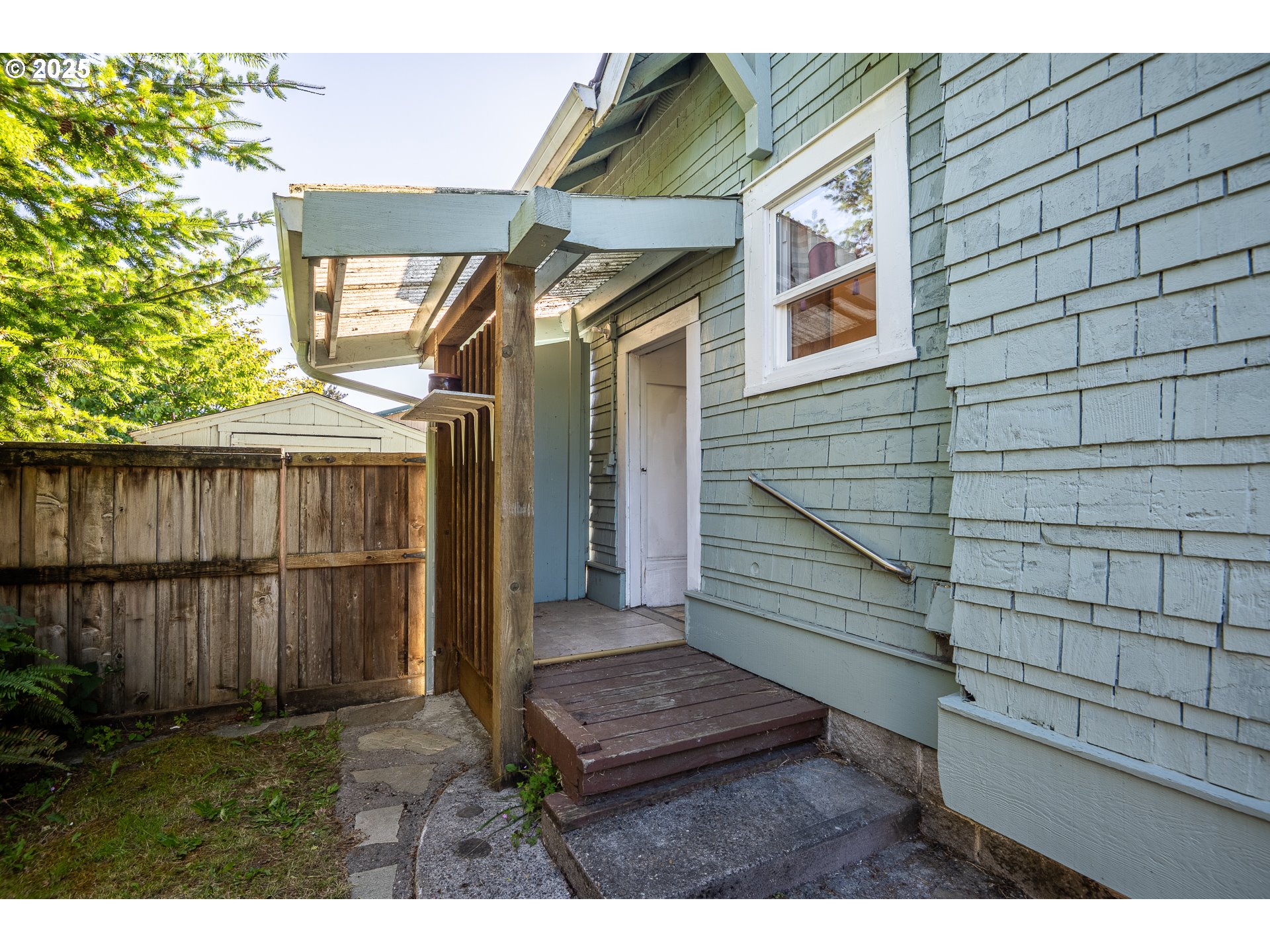 289 Harbor Street Florence, OR 97439 - Photo 40 of 47 a view of house with wooden floor and a small garden