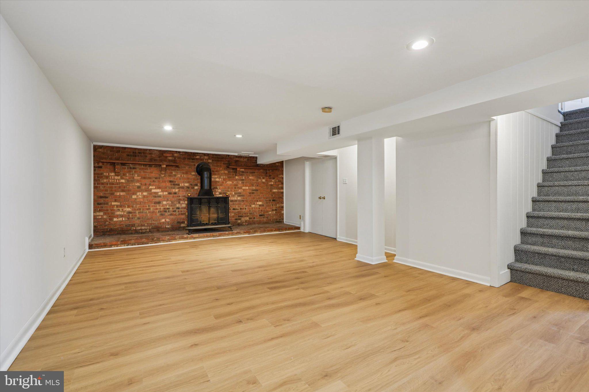 941 Church Road Springfield, PA 19064 - Photo 26 of 39 New luxury vinyl plank flooring, brick accent wall