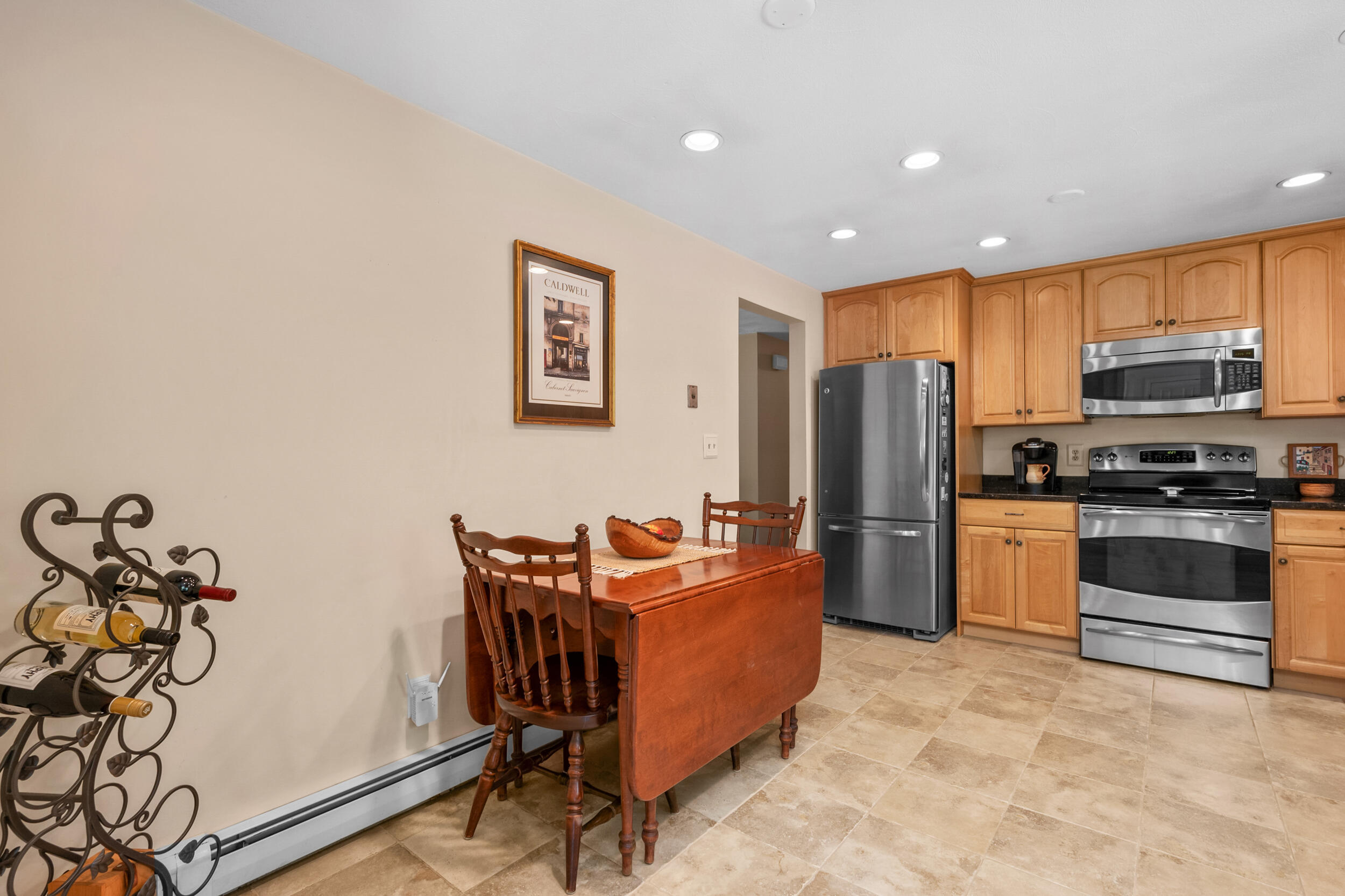 19 Shagbark Road Forestdale, MA 02644 - Photo 11 of 44 a kitchen with stainless steel appliances granite countertop a refrigerator and a stove top oven