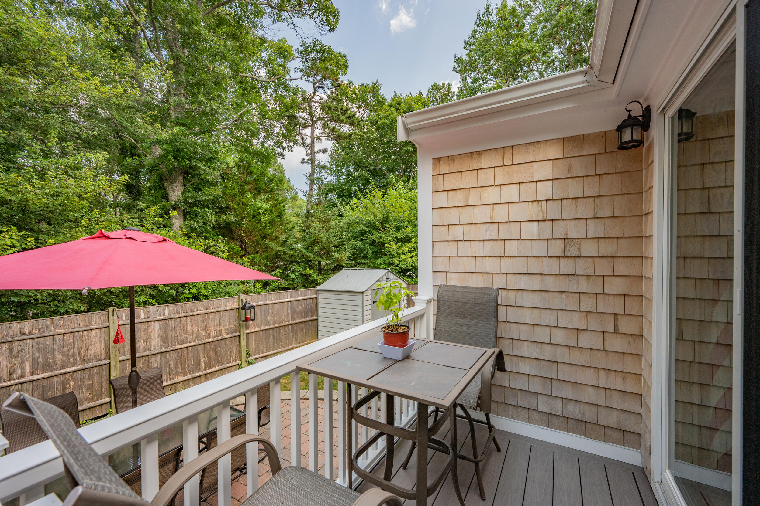 19 Shagbark Road Forestdale, MA 02644 - Photo 35 of 44 a view of a balcony with a table and chairs