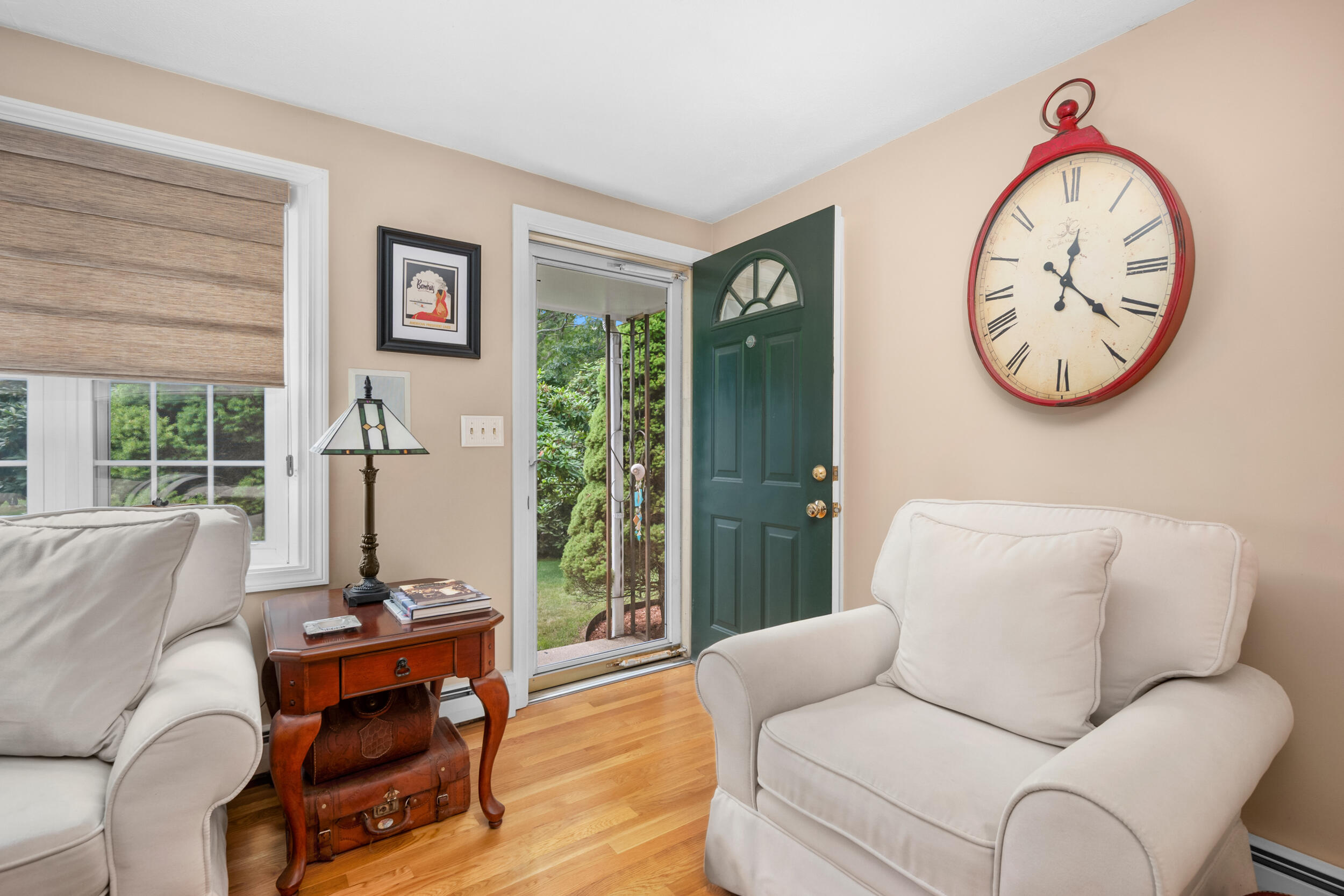 19 Shagbark Road Forestdale, MA 02644 - Photo 4 of 44 a living room with furniture a large window and a clock