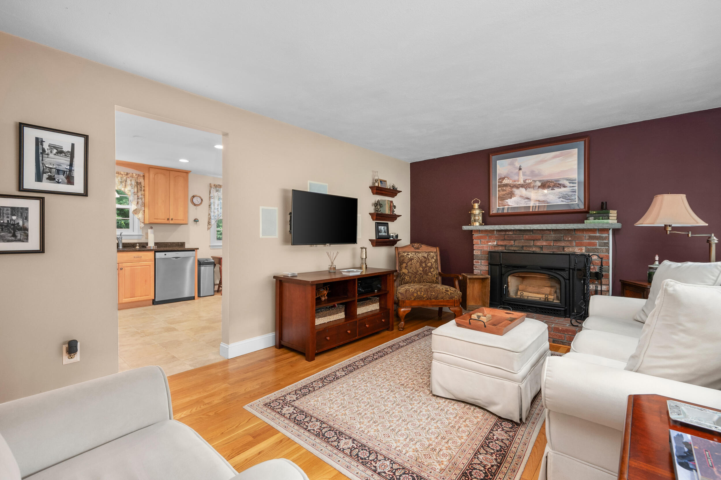 19 Shagbark Road Forestdale, MA 02644 - Photo 5 of 44 a living room with furniture a flat screen tv and a fireplace