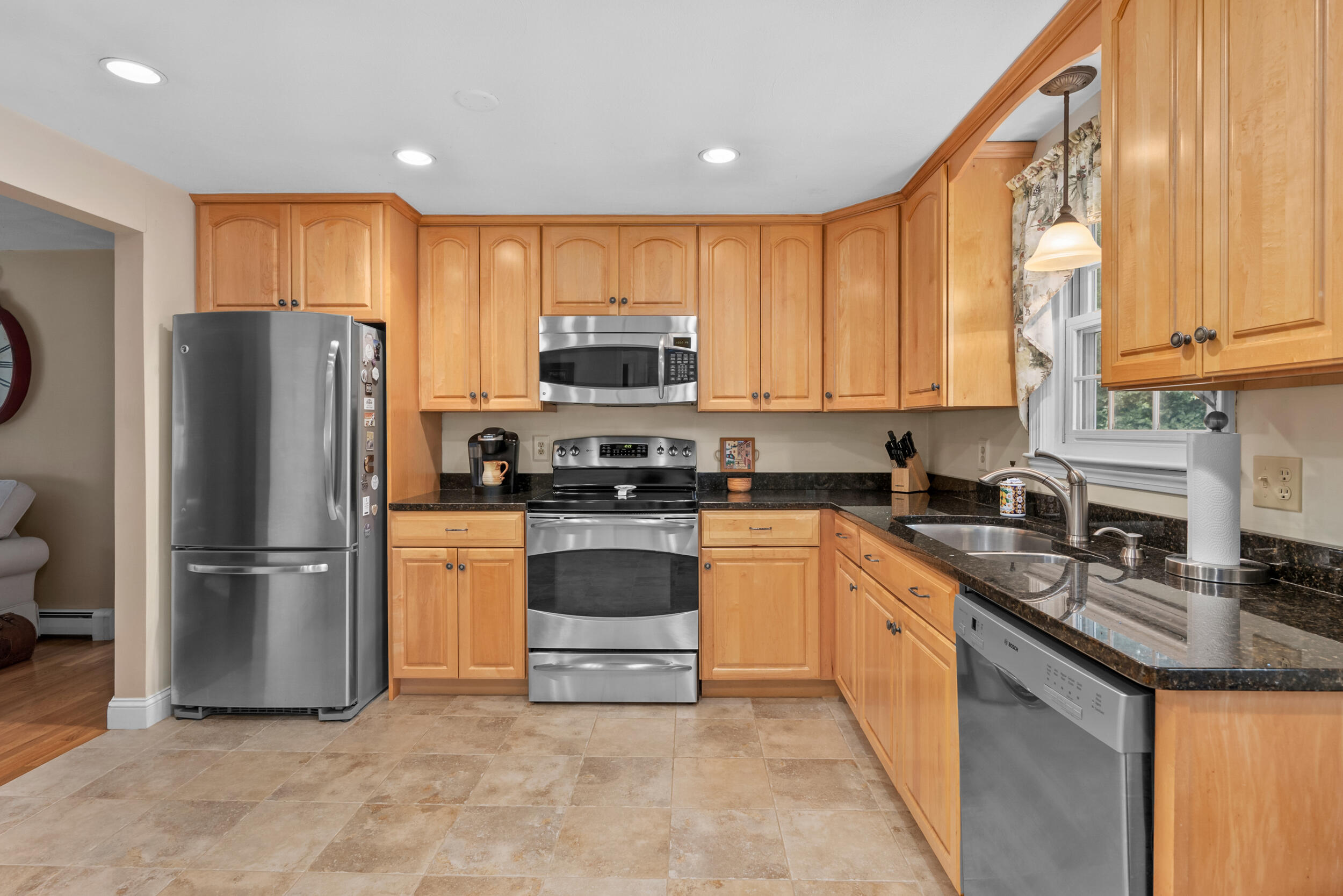 19 Shagbark Road Forestdale, MA 02644 - Photo 9 of 44 a kitchen with stainless steel appliances granite countertop a refrigerator stove microwave and sink