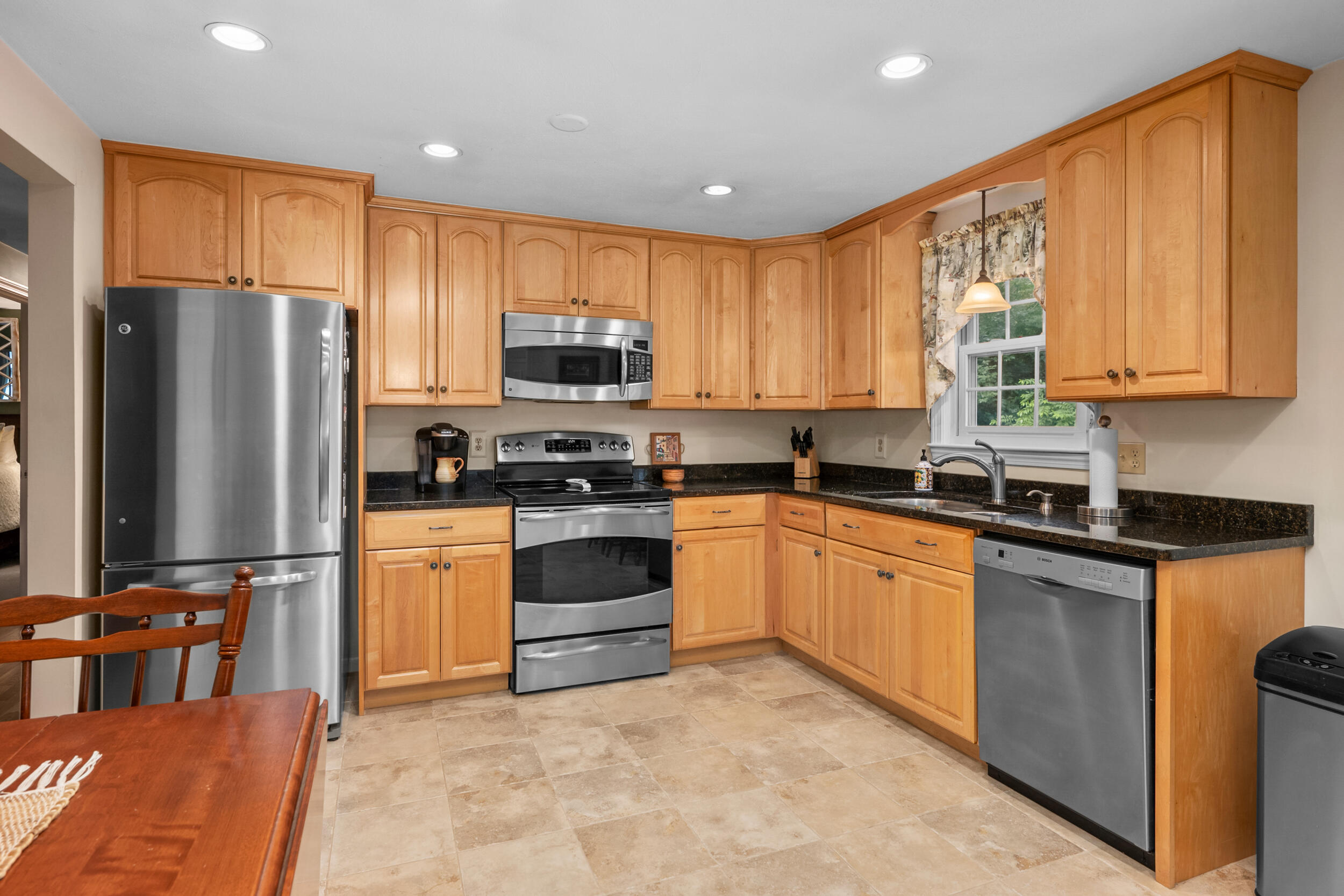19 Shagbark Road Forestdale, MA 02644 - Photo 10 of 44 a kitchen with stainless steel appliances granite countertop a refrigerator stove top oven and sink