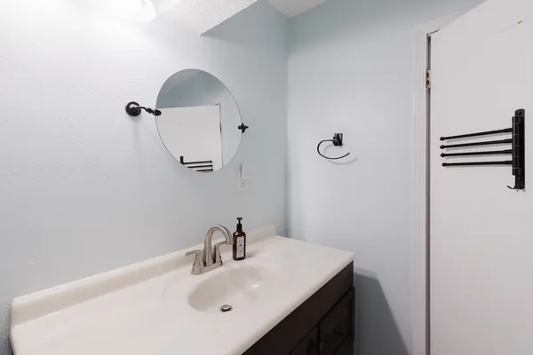 a view of a room with furniture and window