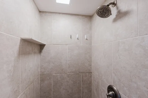 a backyard of a house with wooden floor chairs and wooden floor
