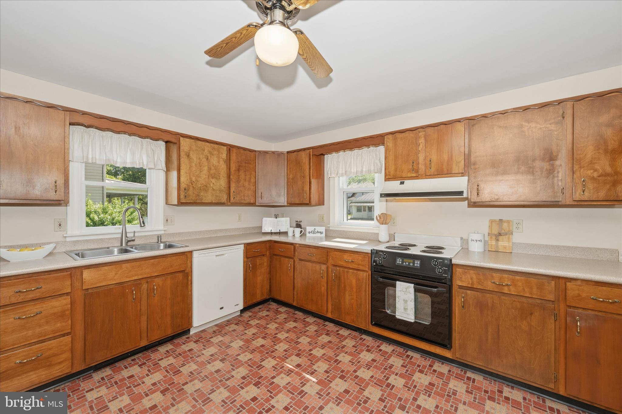 11205 Hessong Bridge Road Thurmont, MD 21788 - Photo 13 of 69 a kitchen with a sink cabinets appliances and a window