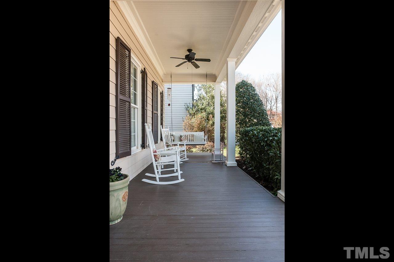 3105 Raymond Street Raleigh, NC 27607 - Photo 2 of 22 a balcony with wooden floor and outdoor seating