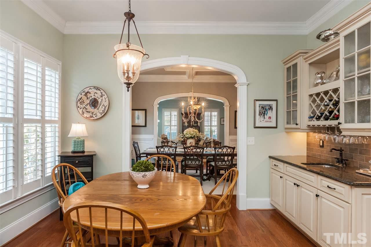 3105 Raymond Street Raleigh, NC 27607 - Photo 11 of 22 a view of a dining room with furniture window and wooden floor