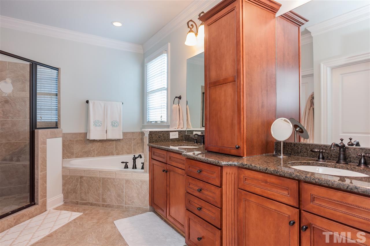 3105 Raymond Street Raleigh, NC 27607 - Photo 15 of 22 a bathroom with double vanity and a bathtub
