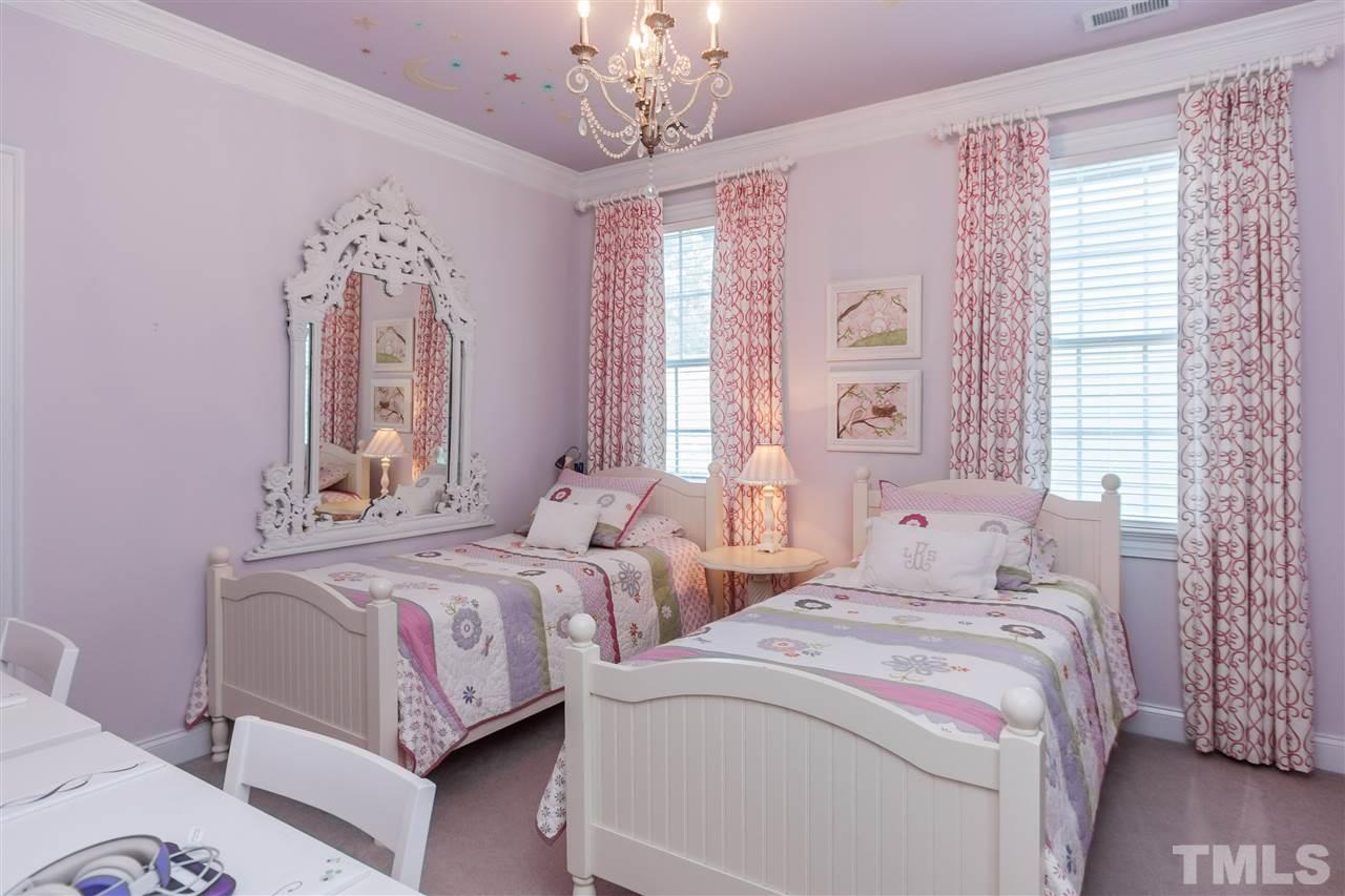 3105 Raymond Street Raleigh, NC 27607 - Photo 17 of 22 a bedroom with two beds and a chandelier
