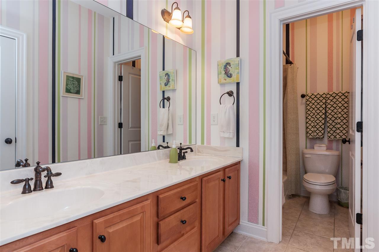 3105 Raymond Street Raleigh, NC 27607 - Photo 18 of 22 a bathroom with a granite countertop sink toilet and shower