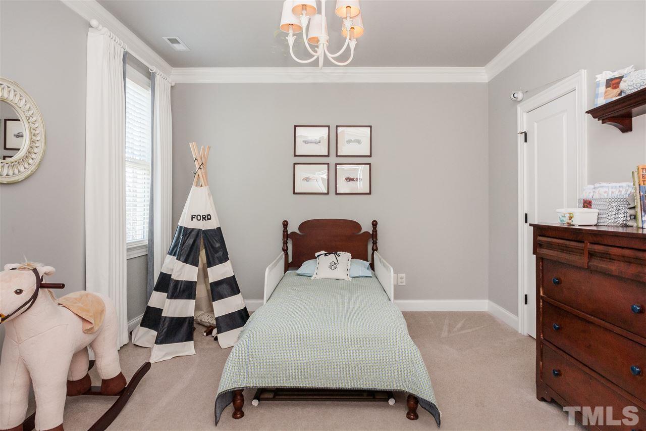 3105 Raymond Street Raleigh, NC 27607 - Photo 19 of 22 a bedroom with a bed and a window