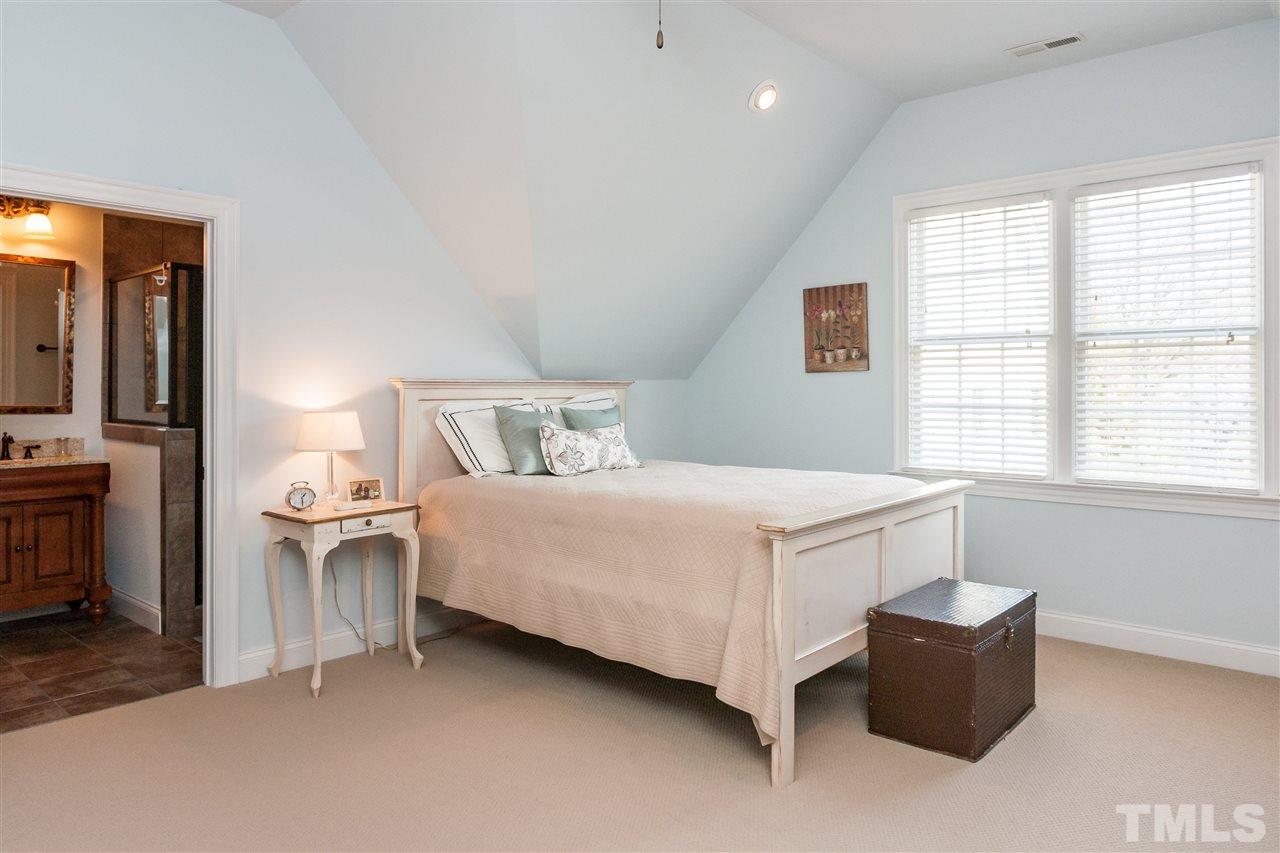 3105 Raymond Street Raleigh, NC 27607 - Photo 20 of 22 a bedroom with a bed and a couch