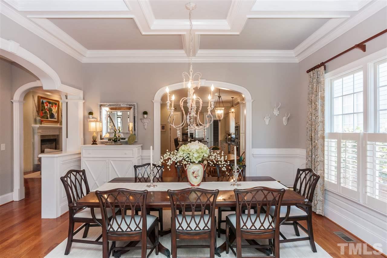 3105 Raymond Street Raleigh, NC 27607 - Photo 5 of 22 a view of a dining room with furniture wooden floor and chandelier