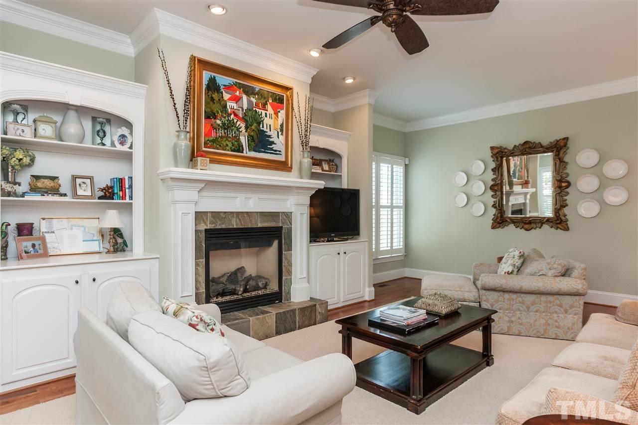3105 Raymond Street Raleigh, NC 27607 - Photo 6 of 22 a living room with furniture and a fireplace