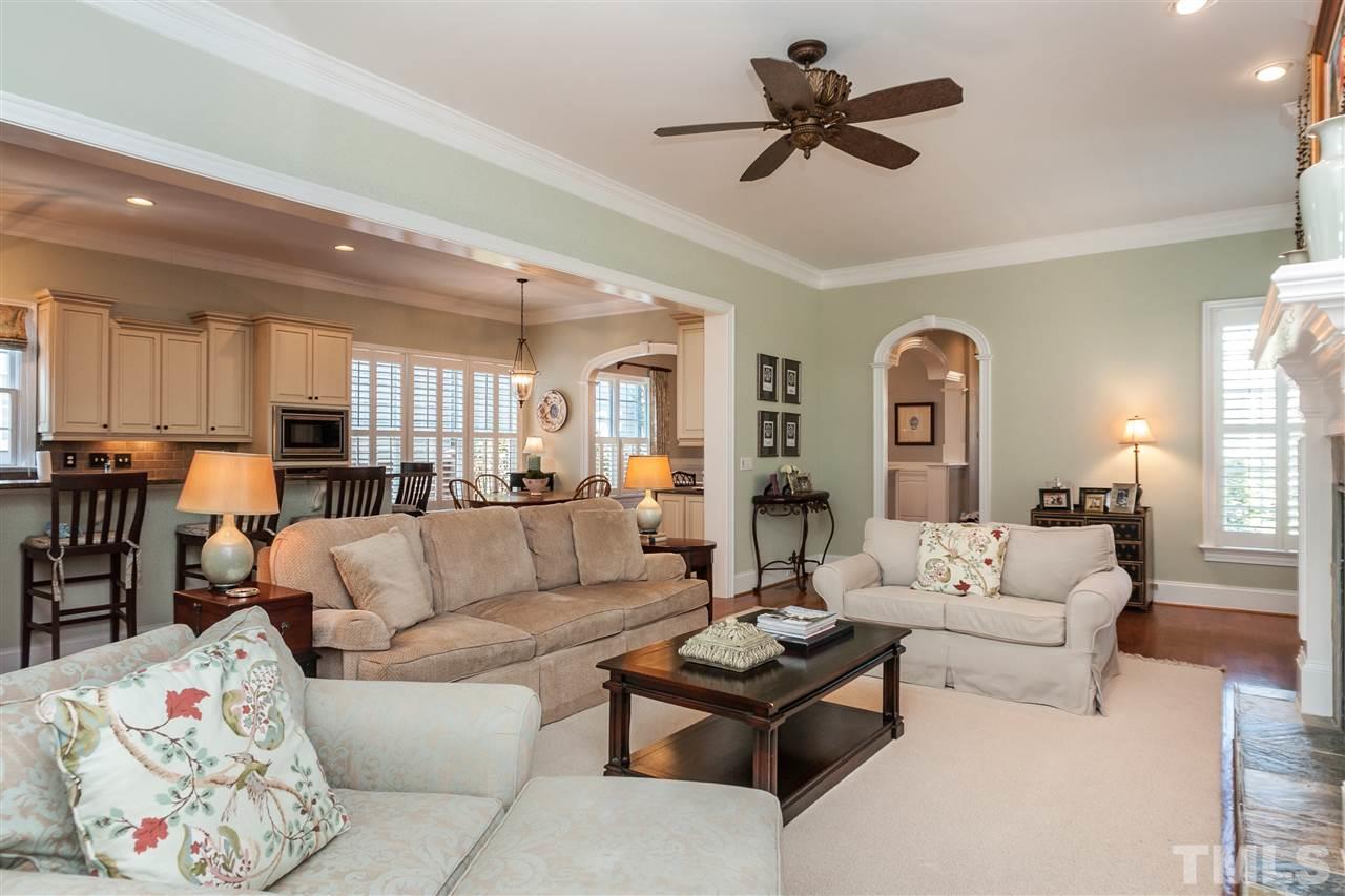 3105 Raymond Street Raleigh, NC 27607 - Photo 7 of 22 a living room with furniture kitchen view and a chandelier