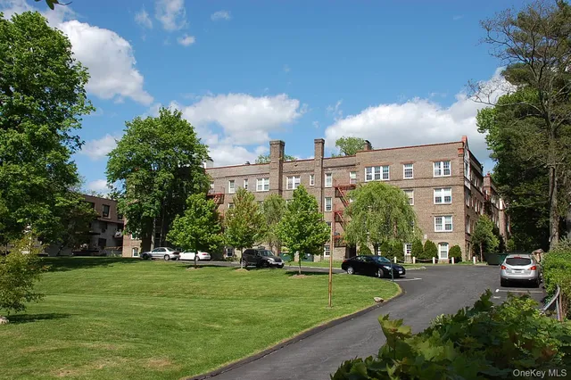 a view of a building with a yard
