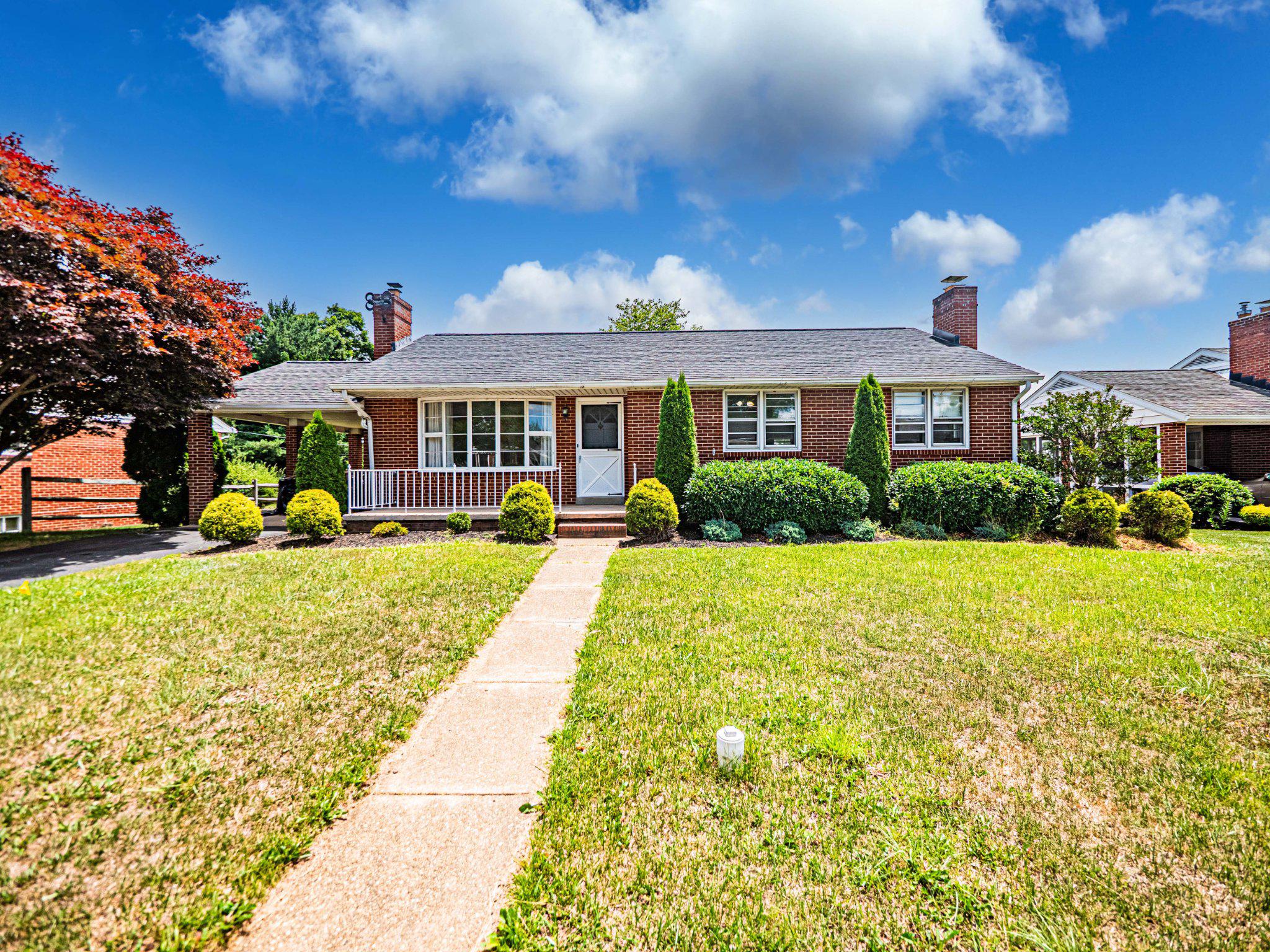 9907 Forge Park Road Perry Hall, MD 21128 - Photo 1 of 36 Charming brick home with lush greenery.