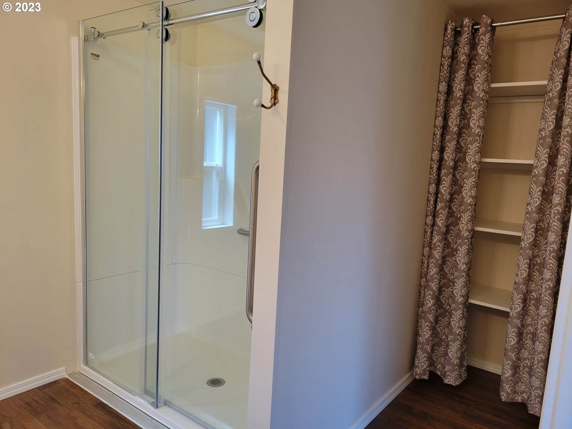 1315 Settlers Loop Forest Grove, OR 97116 - Photo 20 of 37 a bathroom with a glass shower door