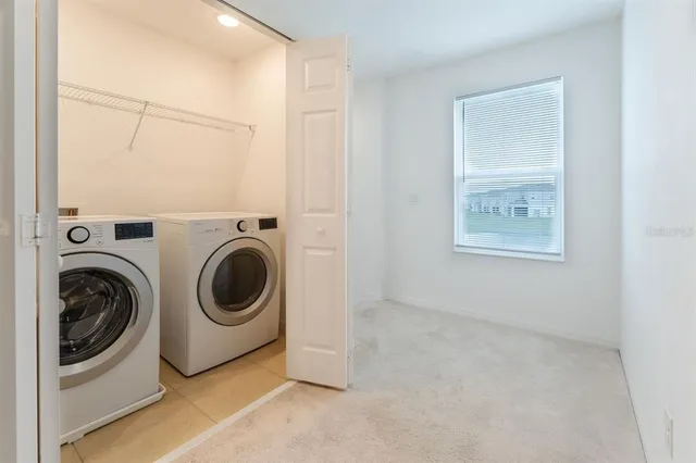 a utility room with dryer and washer
