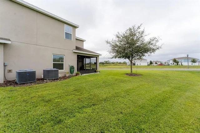 a swimming pool with some trees in the background