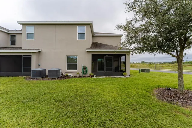 a view of a house with a garden and yard