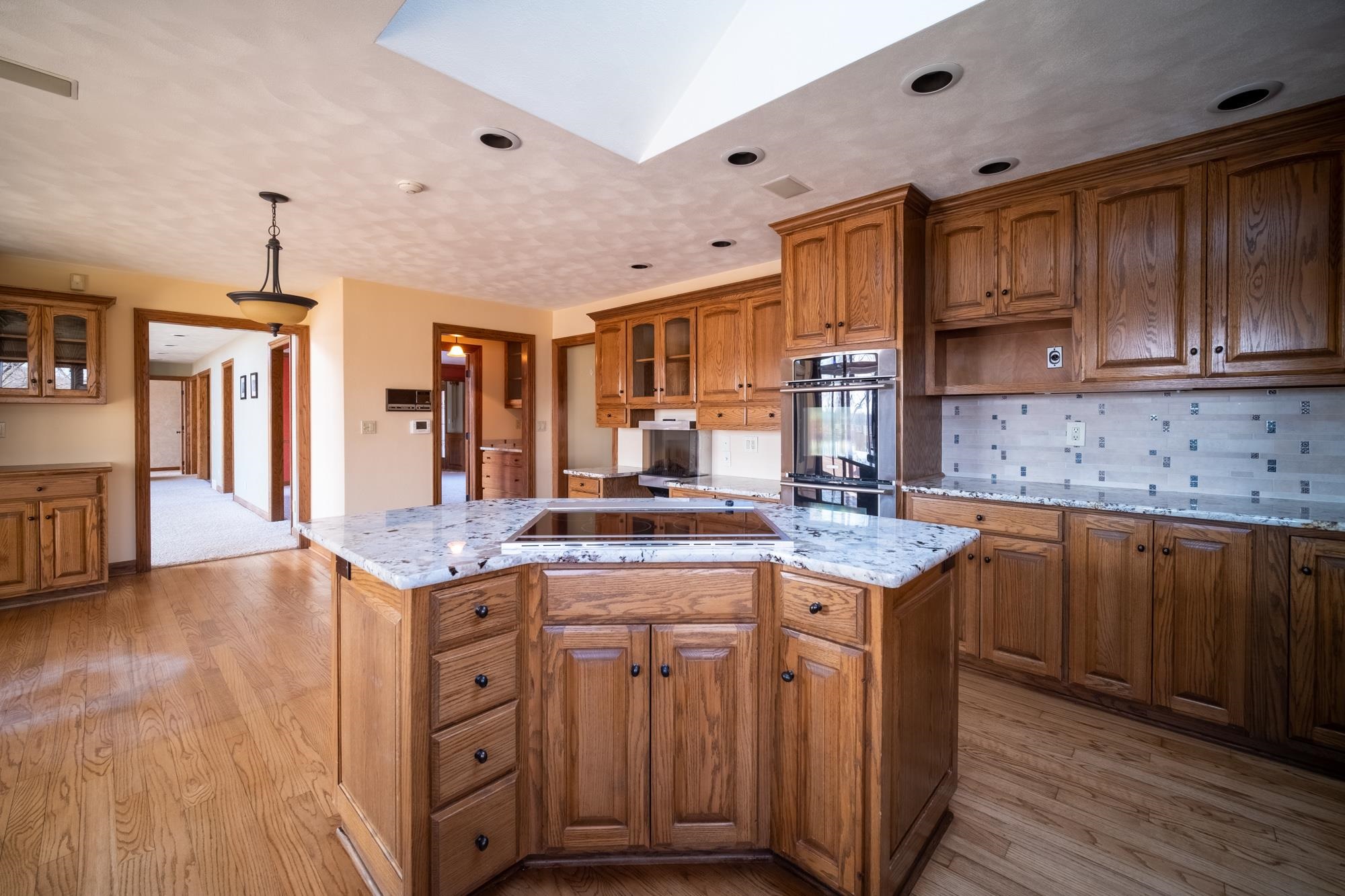9805 Rivers Bend Drive Roscoe, IL 61073 - Photo 12 of 49 a kitchen with a sink stove and cabinets