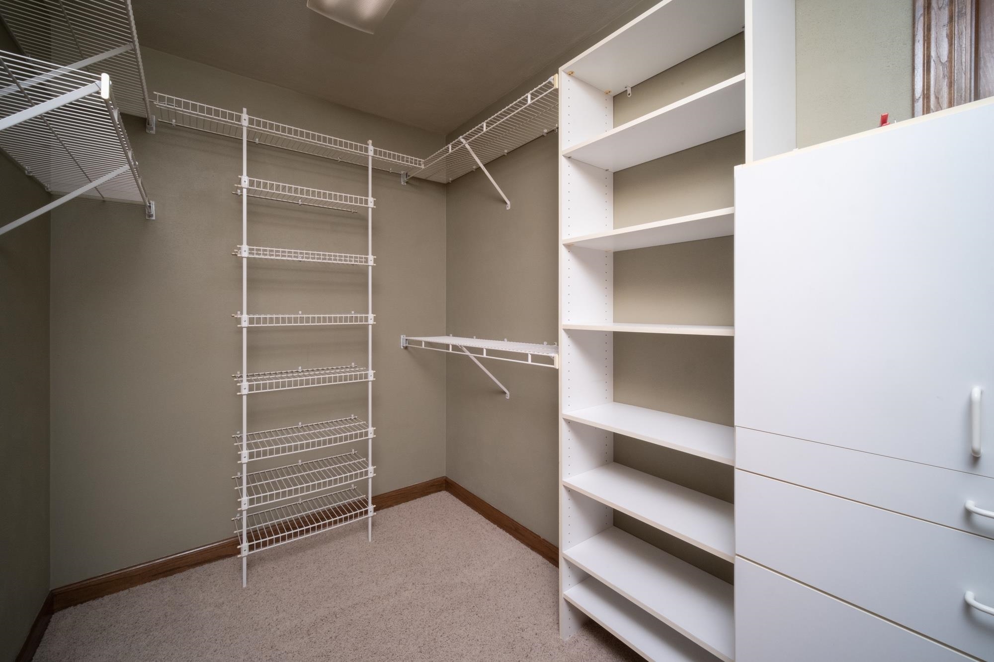 9805 Rivers Bend Drive Roscoe, IL 61073 - Photo 27 of 49 a view of walk in closet with empty racks