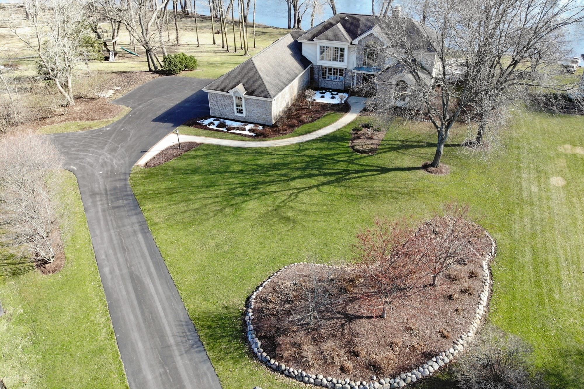 9805 Rivers Bend Drive Roscoe, IL 61073 - Photo 3 of 49 a view of a swimming pool with a yard