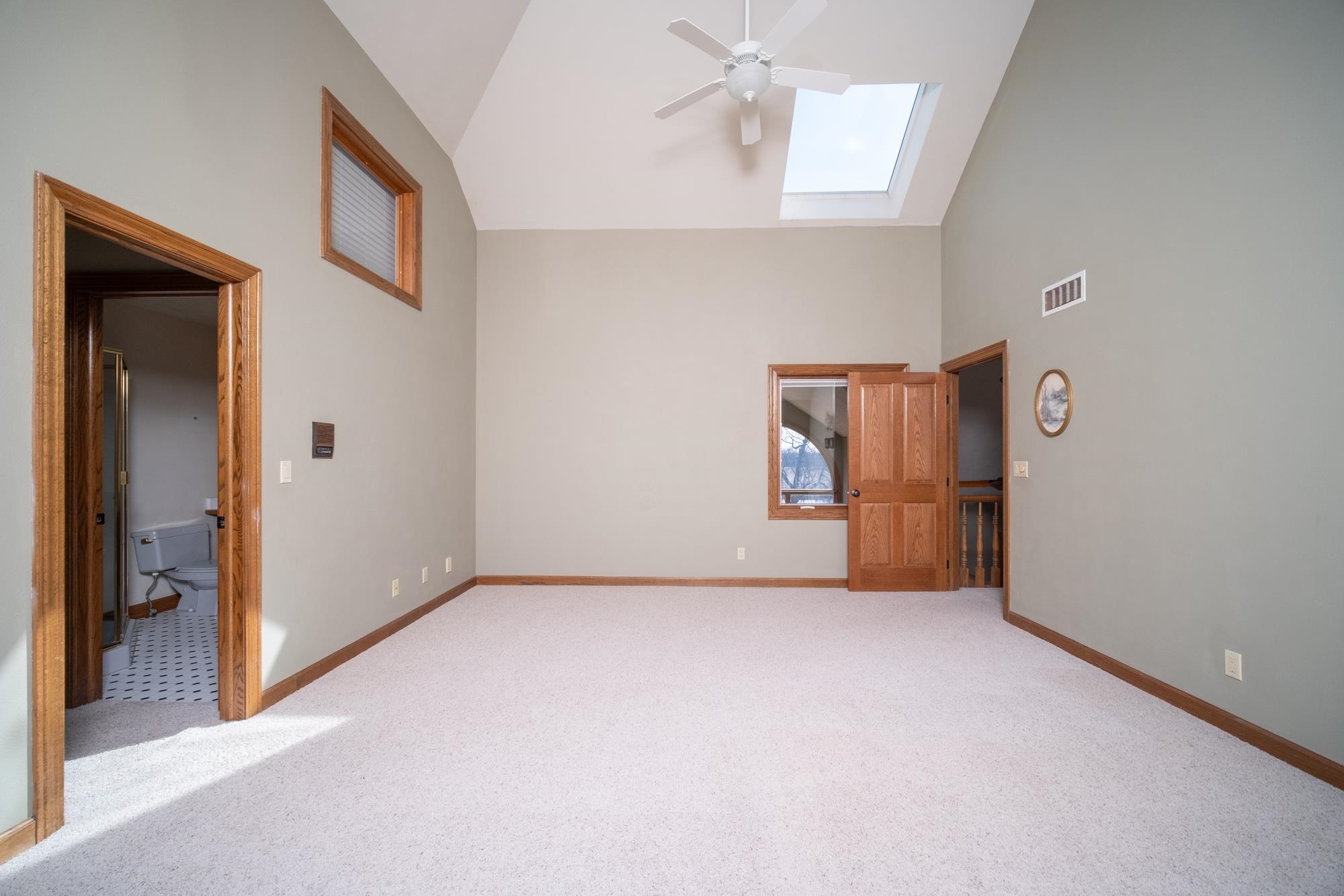 9805 Rivers Bend Drive Roscoe, IL 61073 - Photo 31 of 49 an empty room with chandelier fan and windows