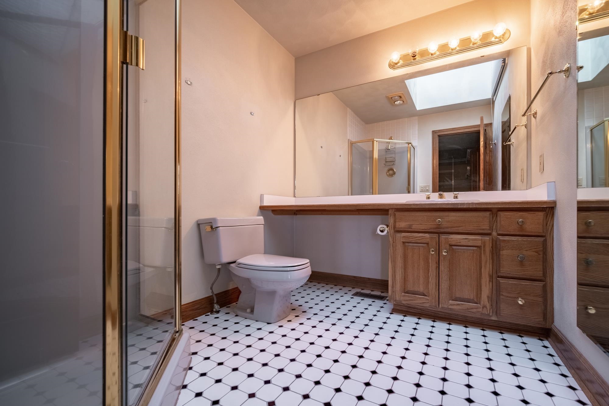 9805 Rivers Bend Drive Roscoe, IL 61073 - Photo 32 of 49 a bathroom with a toilet a sink and a mirror