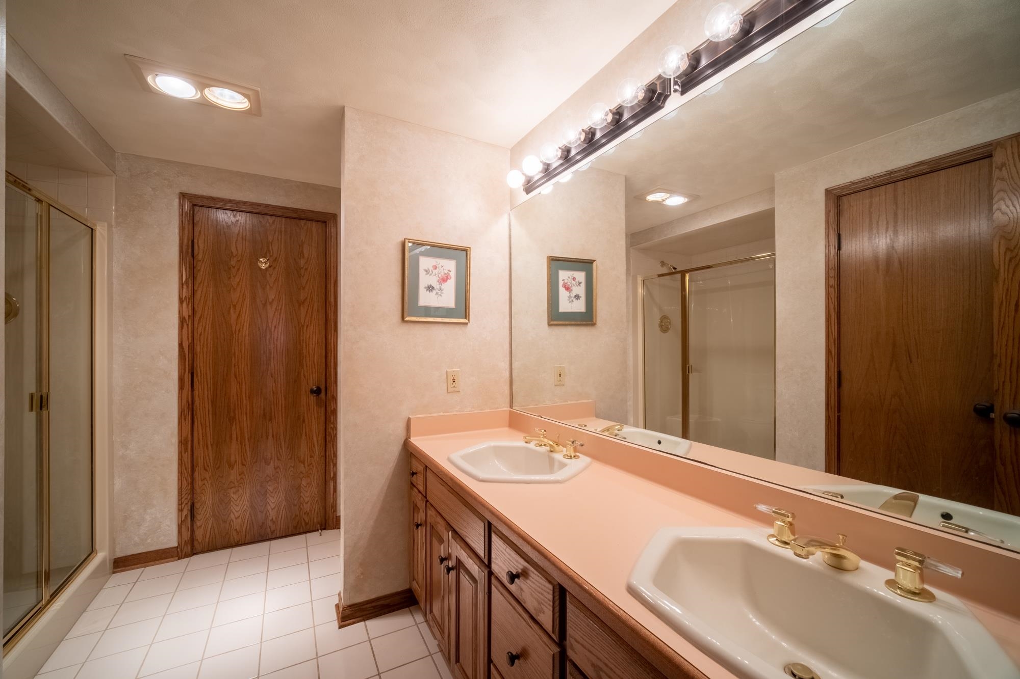 9805 Rivers Bend Drive Roscoe, IL 61073 - Photo 38 of 49 a bathroom with a double vanity sink and a mirror