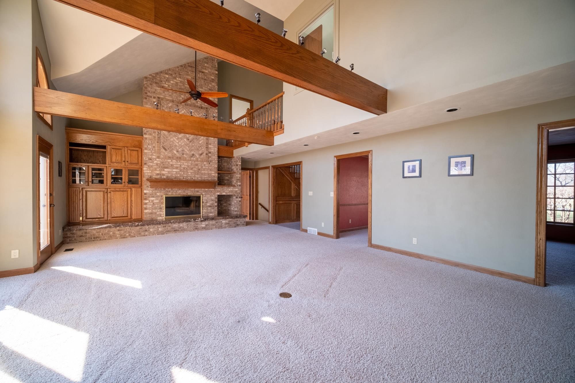 9805 Rivers Bend Drive Roscoe, IL 61073 - Photo 7 of 49 a view of a livingroom with a fireplace