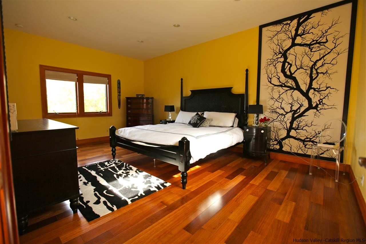 90 High Rocks Road Glenford, NY 12433 - Photo 13 of 34 a bedroom with a bed and wooden floor