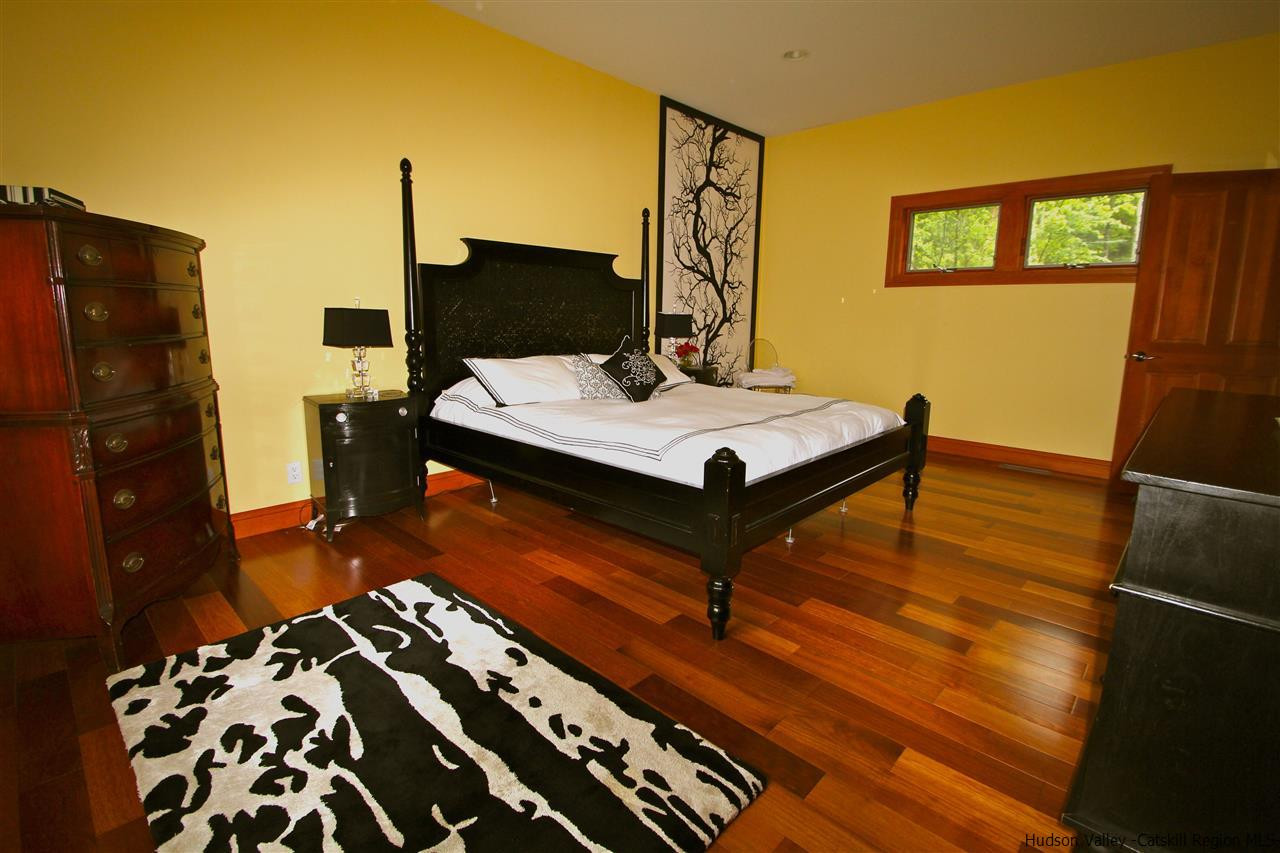 90 High Rocks Road Glenford, NY 12433 - Photo 14 of 34 a living room with a bed and furniture on the wall