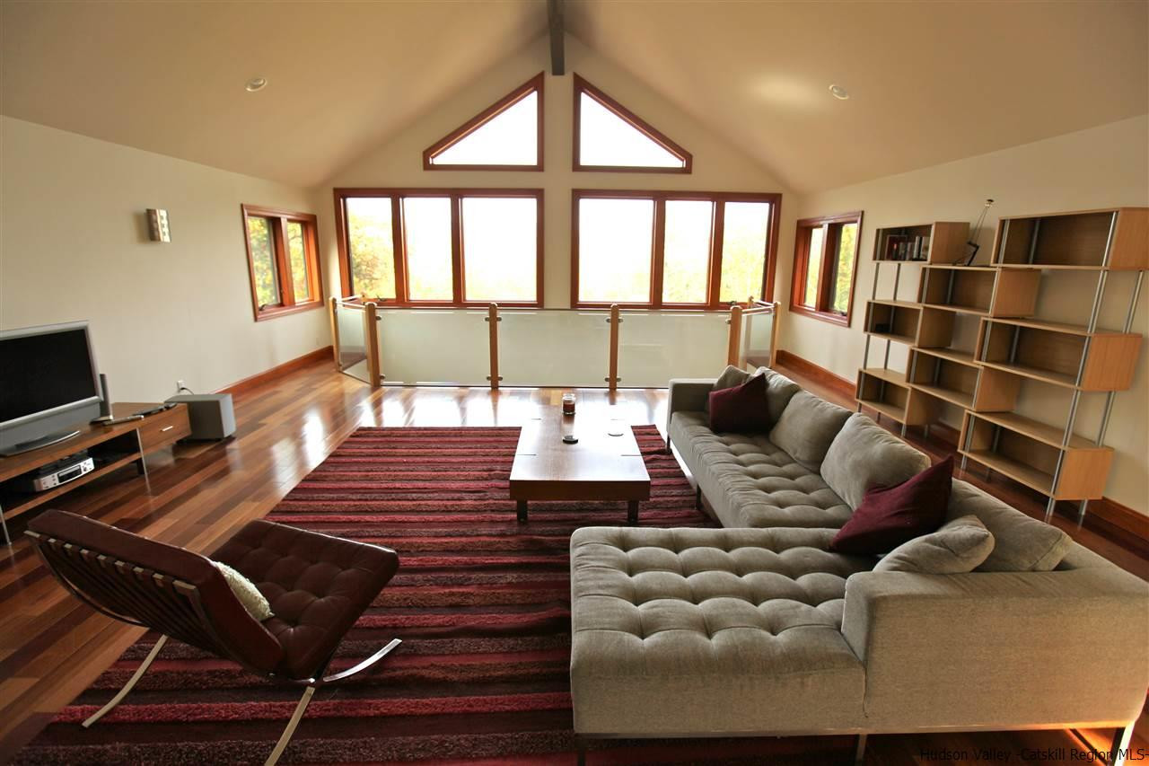 90 High Rocks Road Glenford, NY 12433 - Photo 20 of 34 a living room with furniture and a floor to ceiling window