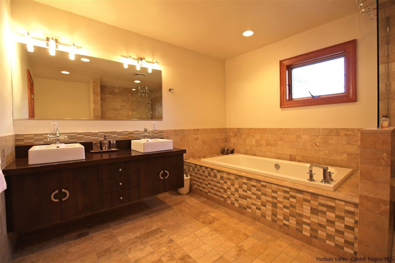 90 High Rocks Road Glenford, NY 12433 - Photo 22 of 34 a bathroom with a bathtub sink and mirror