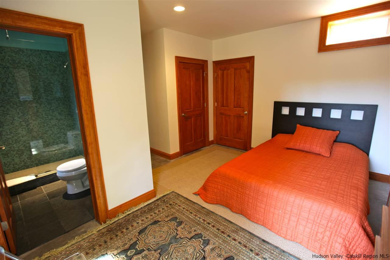 90 High Rocks Road Glenford, NY 12433 - Photo 31 of 34 a bedroom with a bed and wooden floor