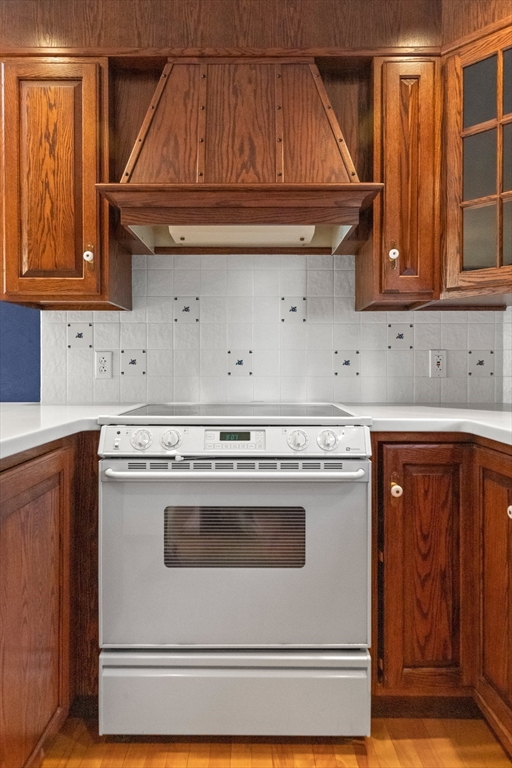 25 High Street Beverly, MA 01915 - Photo 13 of 42 a stove top oven sitting inside of a kitchen