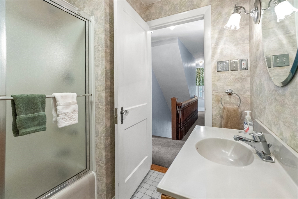 25 High Street Beverly, MA 01915 - Photo 28 of 42 a bathroom with a sink and mirror