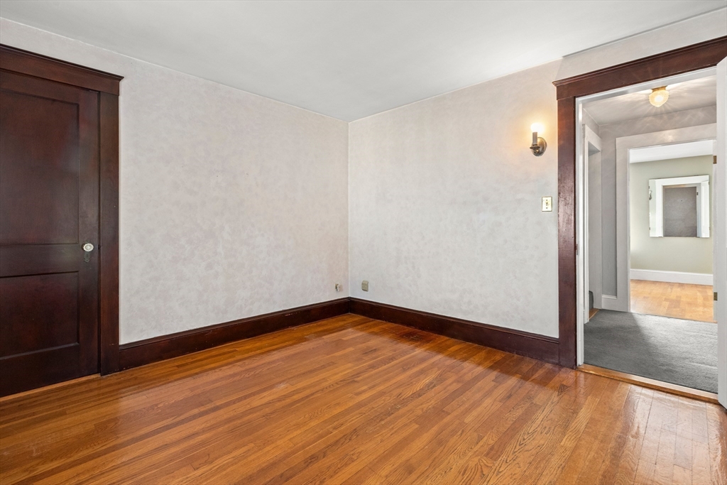 25 High Street Beverly, MA 01915 - Photo 30 of 42 a view of empty room with wooden floor
