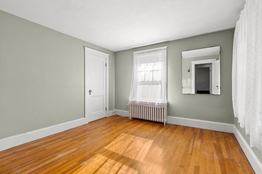 25 High Street Beverly, MA 01915 - Photo 31 of 42 a view of empty room with wooden floor and fan