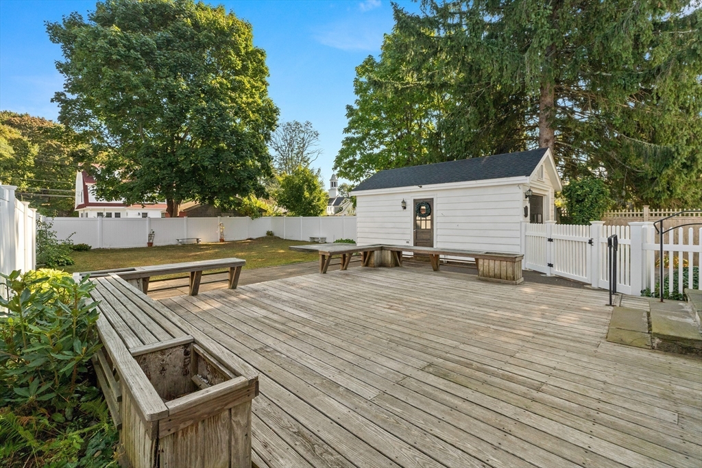 25 High Street Beverly, MA 01915 - Photo 38 of 42 a view of a tennis ground with large trees