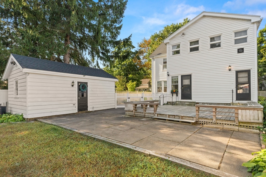 25 High Street Beverly, MA 01915 - Photo 39 of 42 a view of a white house with a patio